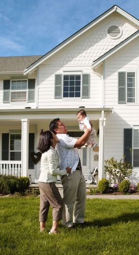 family outside house
